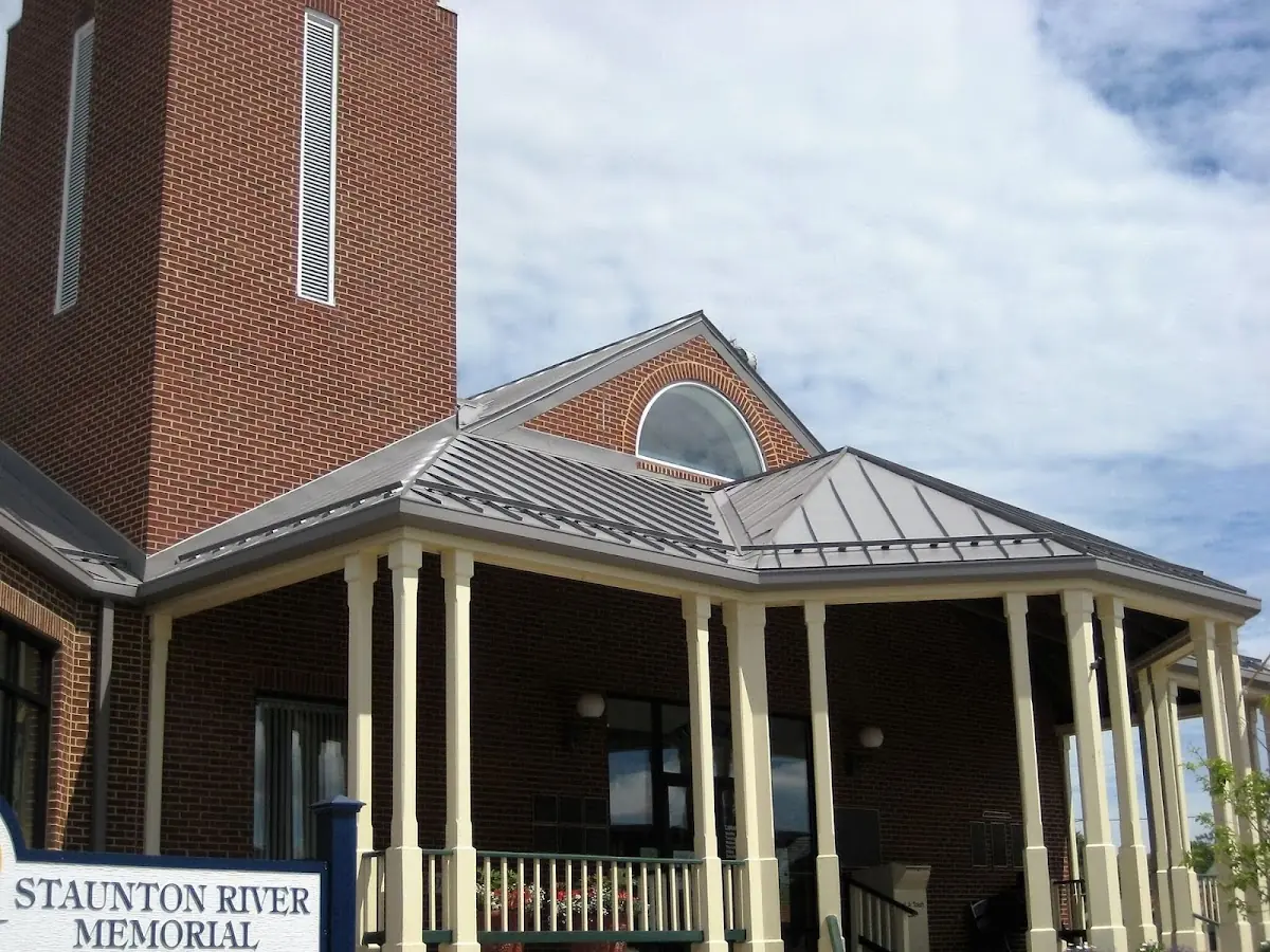 Skilled roofing craftsmen working on a residential roof in Hollins